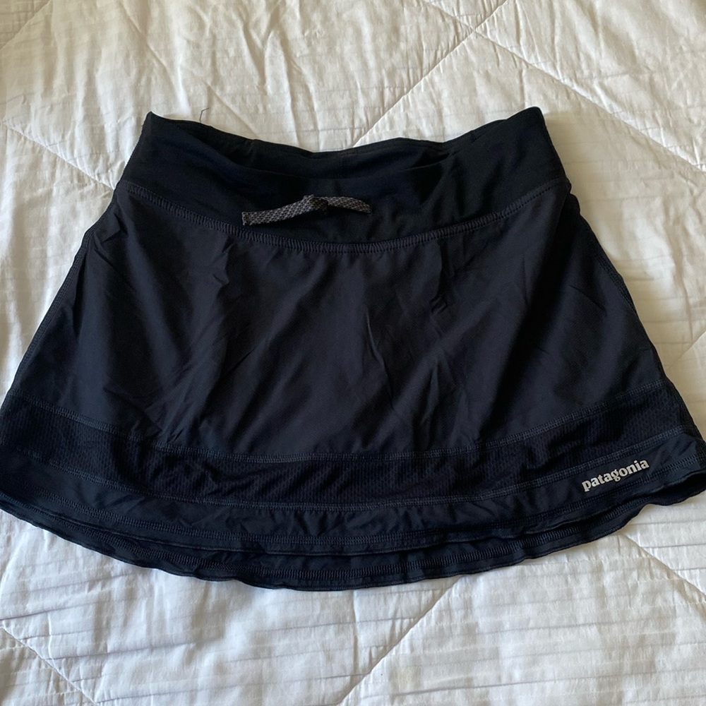 Patagonia black mini skirt with tight biker shorts underneath
